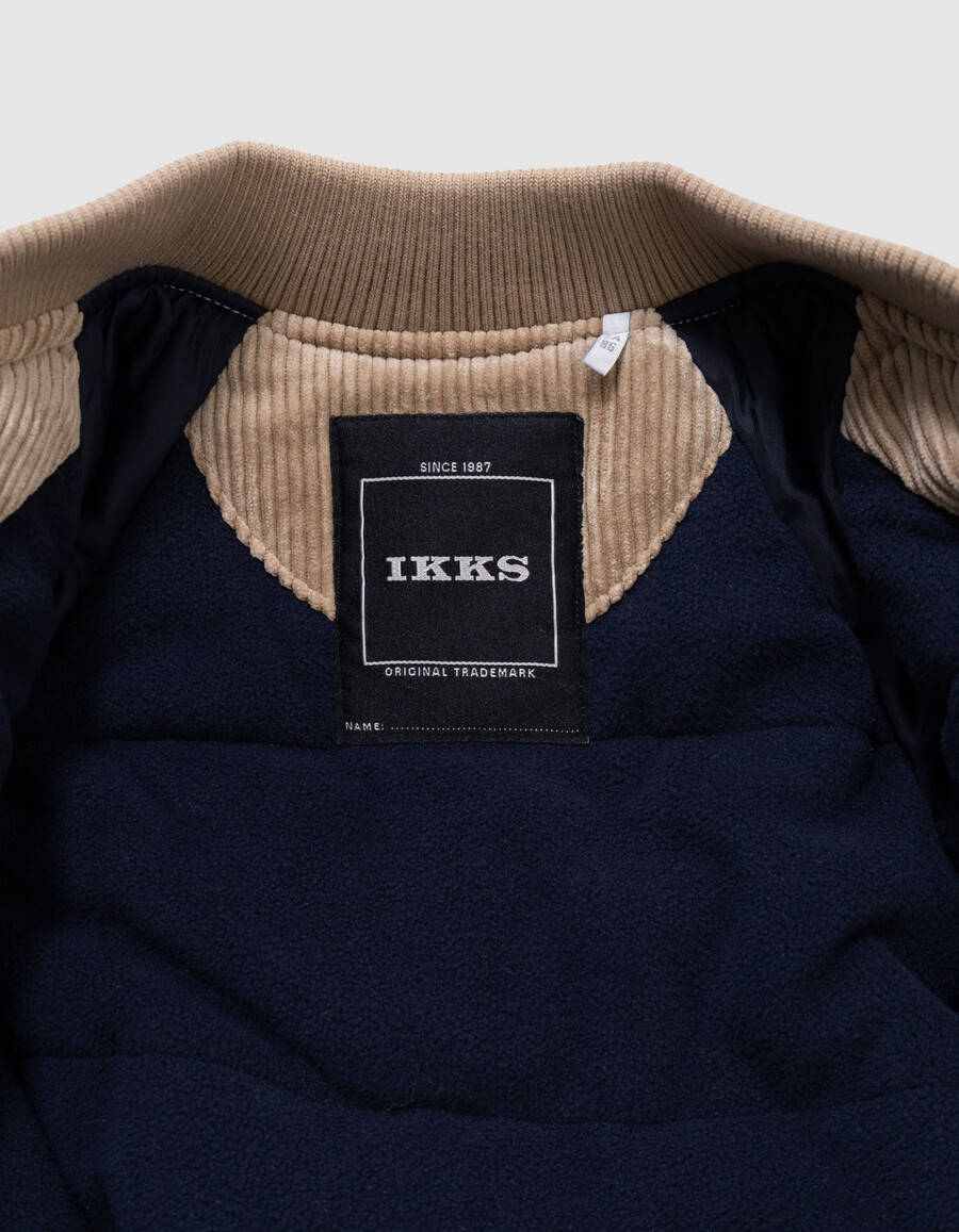 chaqueta estilo universitario de pana beige para niño