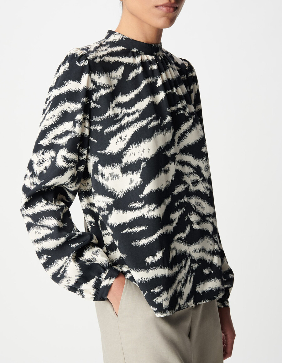 blusa negra con estampado de cebra para mujer