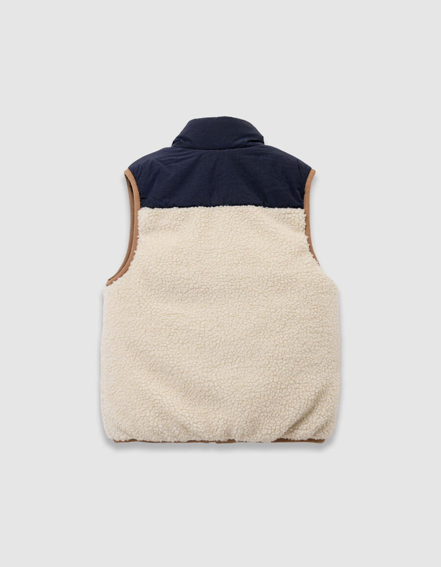 chaqueta acolchada sin mangas reversible en color crudo y azul marino para niño