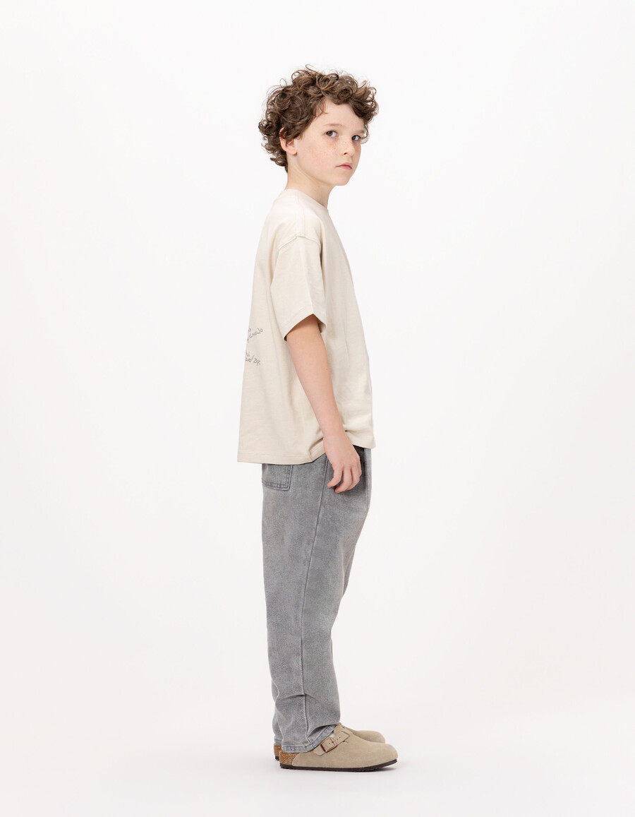 camiseta de algodón orgánico beige para niño bolsillo talla xl imagen trasera