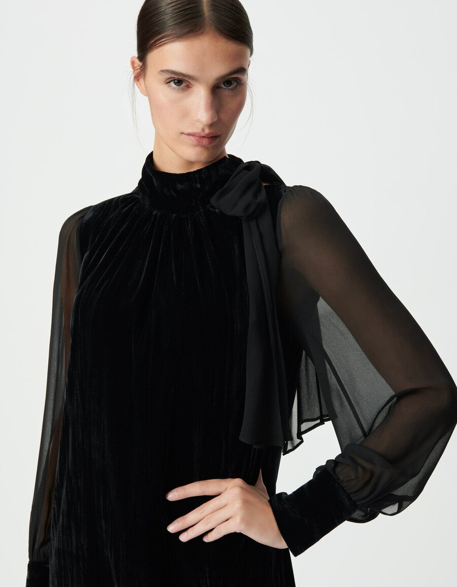 vestido negro de terciopelo y voile para mujer.