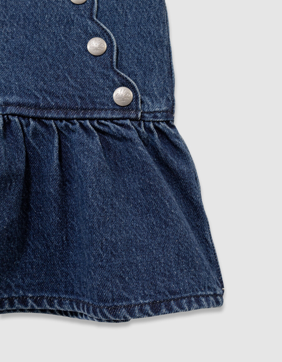 falda vaquera azul para niña con botones a presión estilo caída frontal