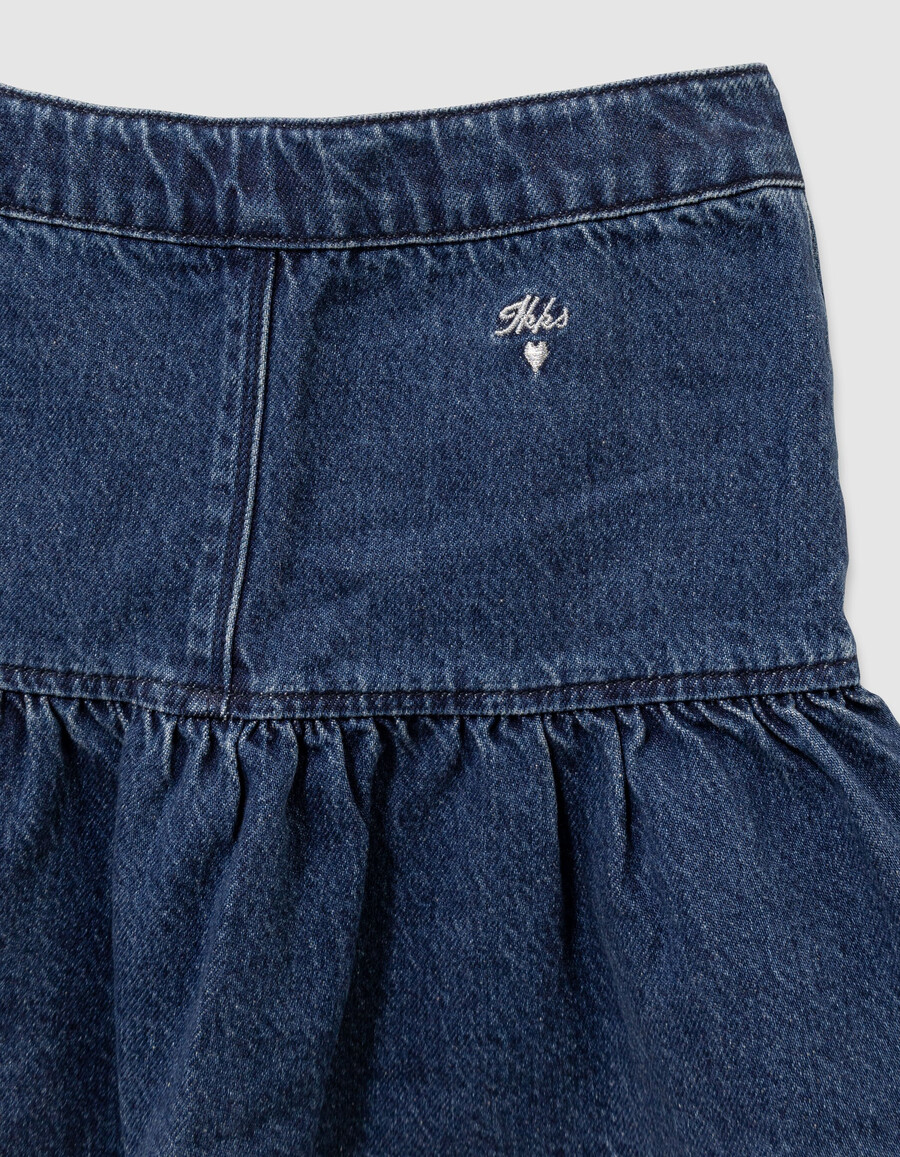 falda vaquera azul para niña con botones a presión estilo caída frontal