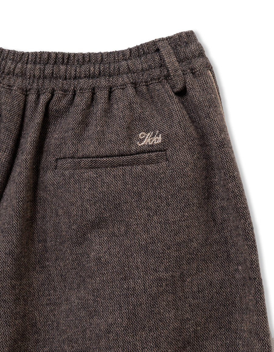 pantalones anchos de franela marrón jaspeada para niña