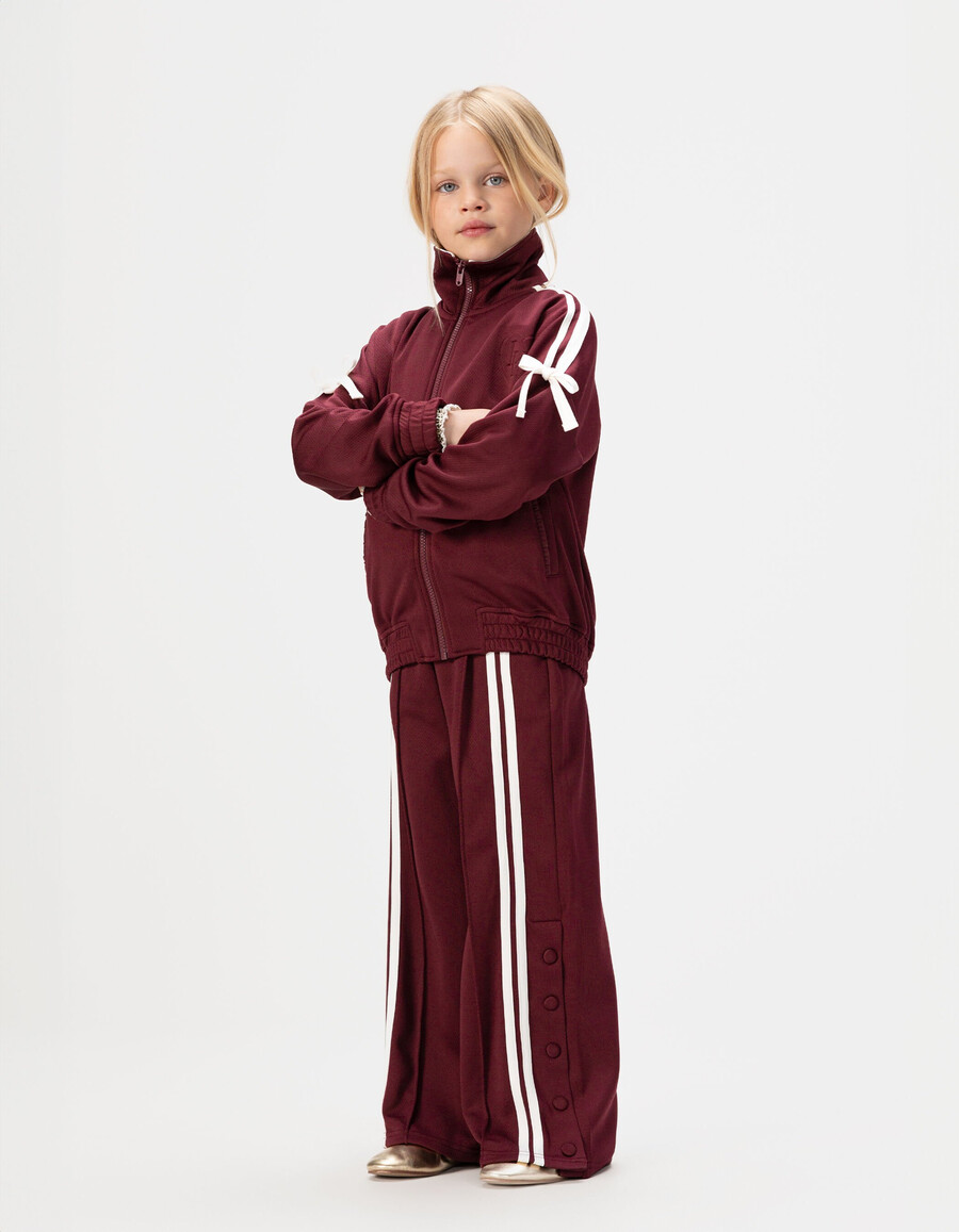 joggers burdeos para niña con rayas blancas