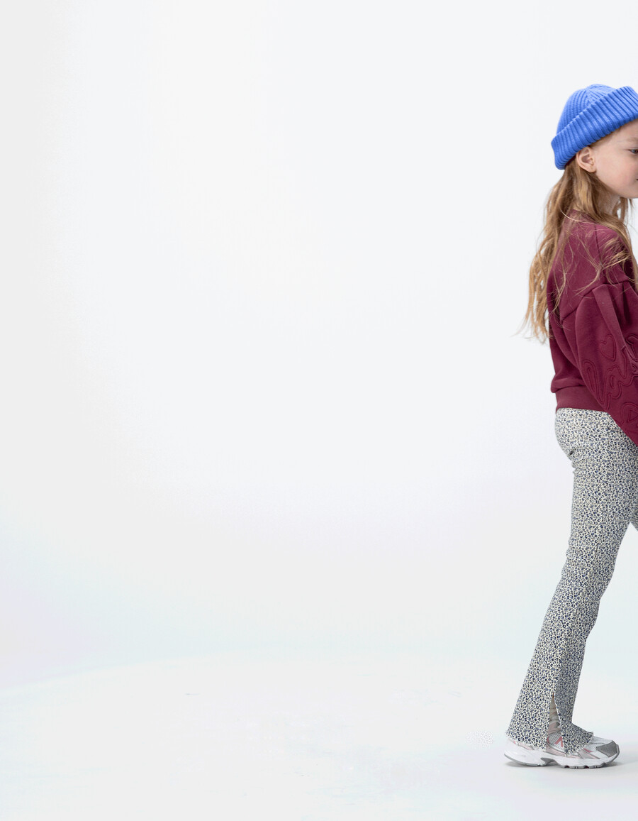 leggings acampanados azul marino para niña con estampado de lazo de leopardo