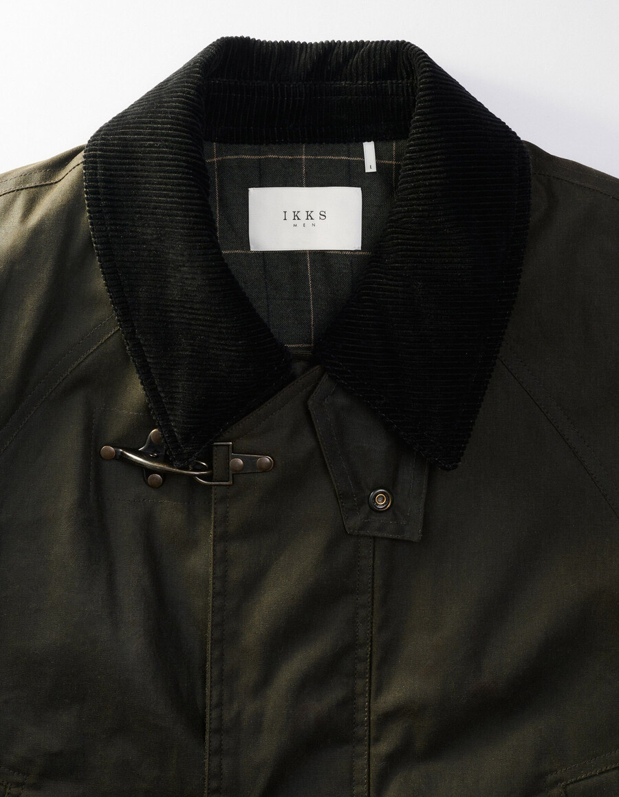parka de tela encerada con múltiples bolsillos para hombre