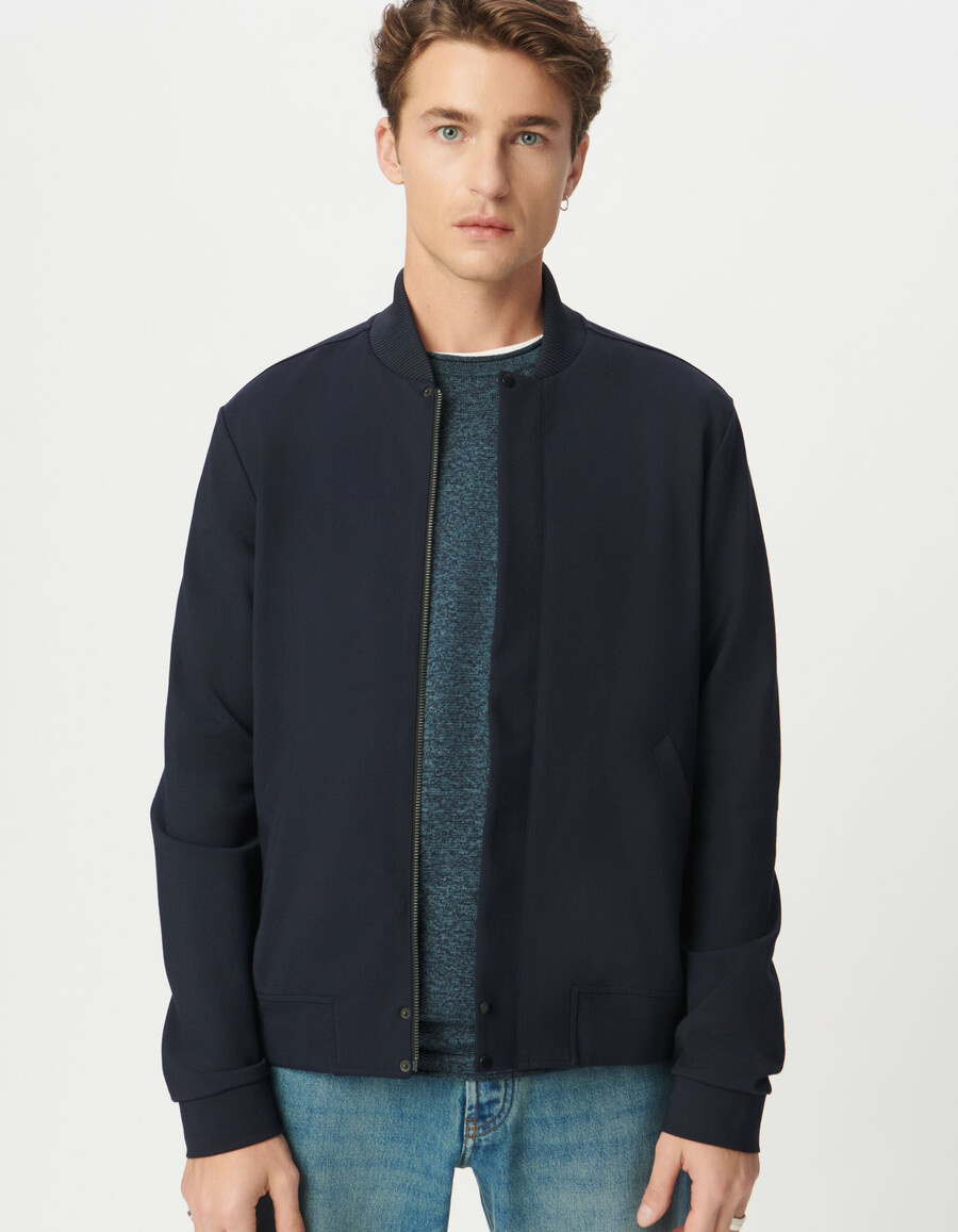 cárdigan azul marino con cremallera y cuello universitario para hombre