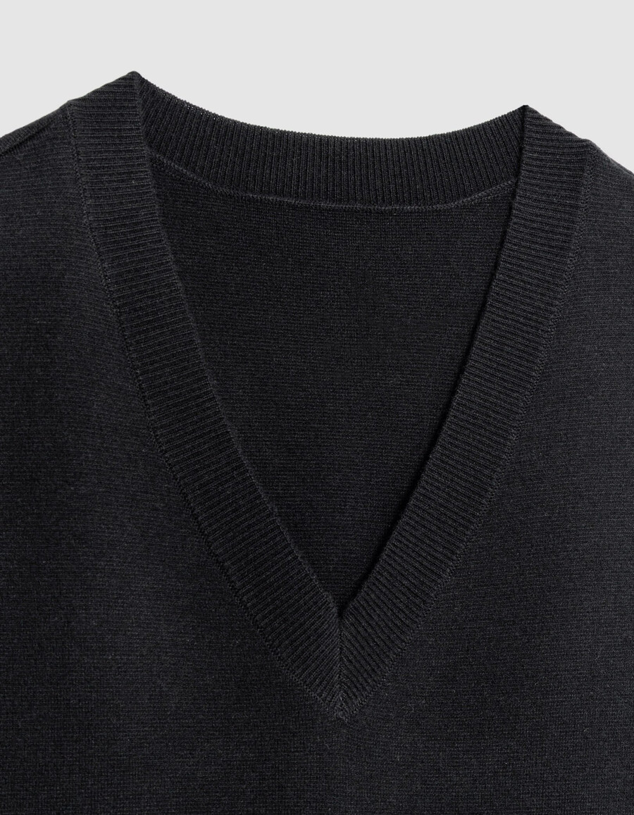 suéter de punto negro sin mangas con cuello en v para hombre