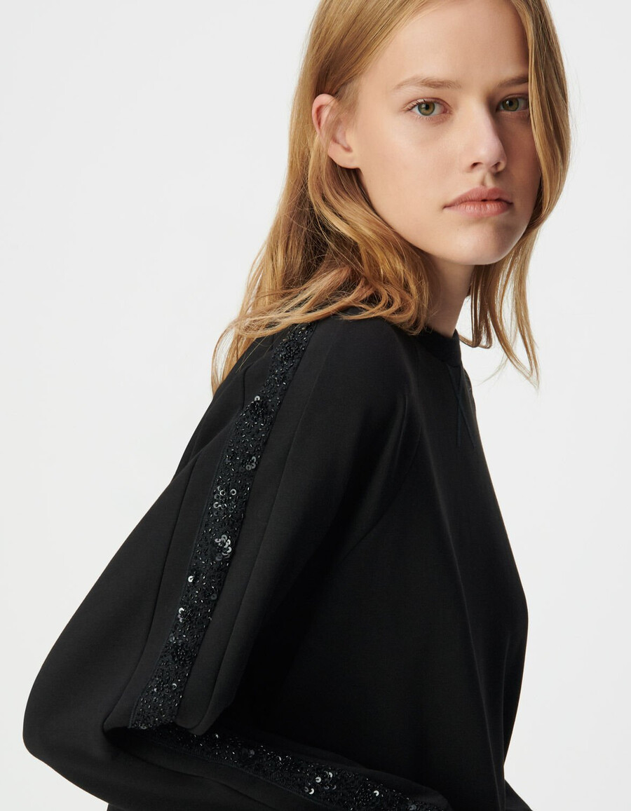 sudadera negra de gran tamaño para mujer con mangas abullonadas