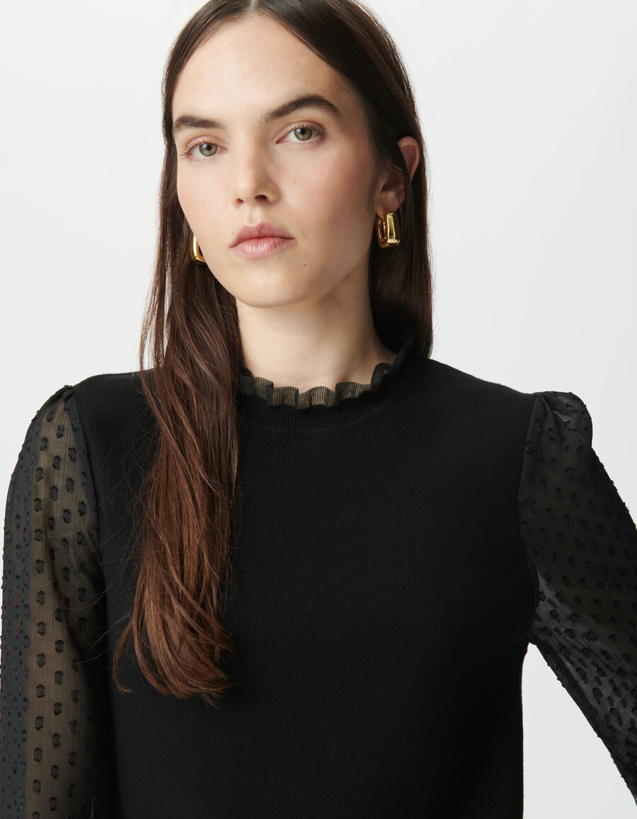 suéter de punto negro para mujer con mangas de voile suizo con lunares