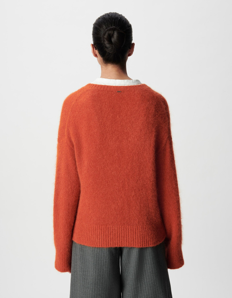 suéter naranja oversize con cuello en v para mujer