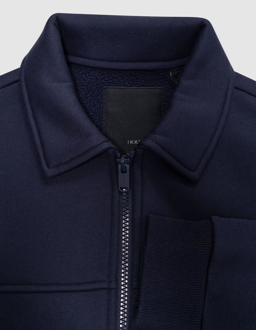 cárdigan azul marino con cremallera y cuello camisero para niño