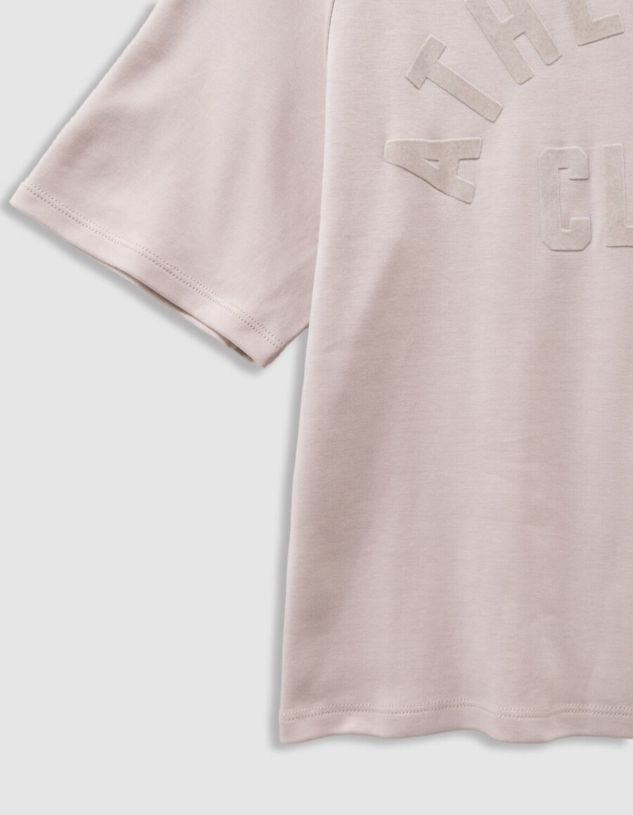 camiseta beige de algodón orgánico para niña con eslogan de terciopelo flocado
