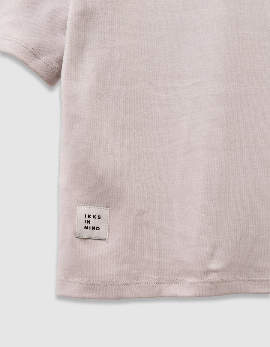 camiseta beige de algodón orgánico para niña con eslogan de terciopelo flocado