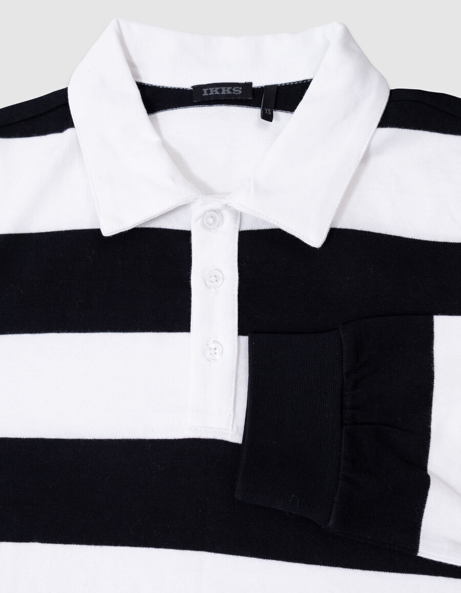 polo negro de manga larga para niño con rayas color crudo