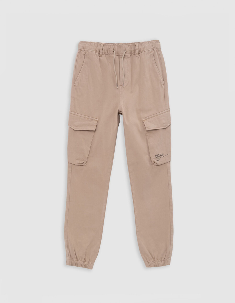 pantalones deportivos beige con cintura elástica para niño