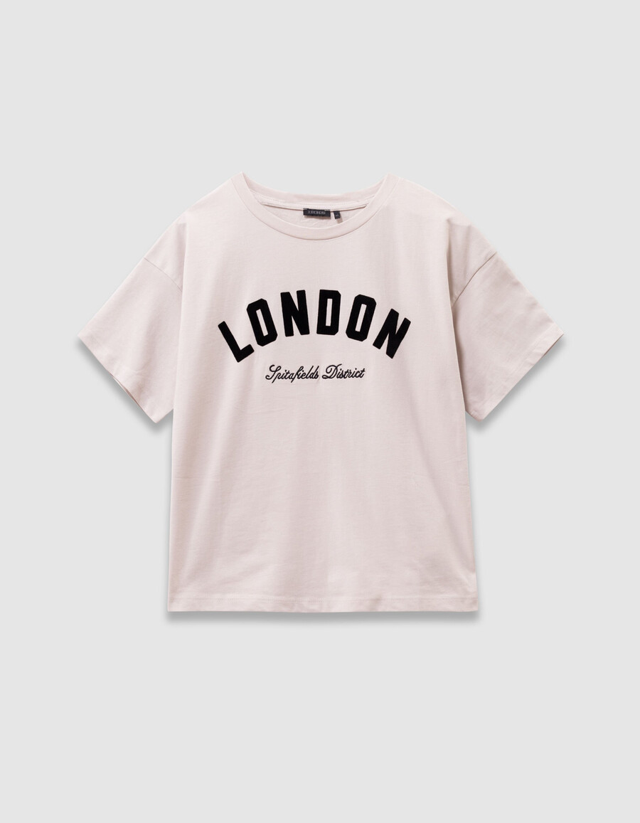 camiseta de algodón orgánico beige para niña con eslóganes negros