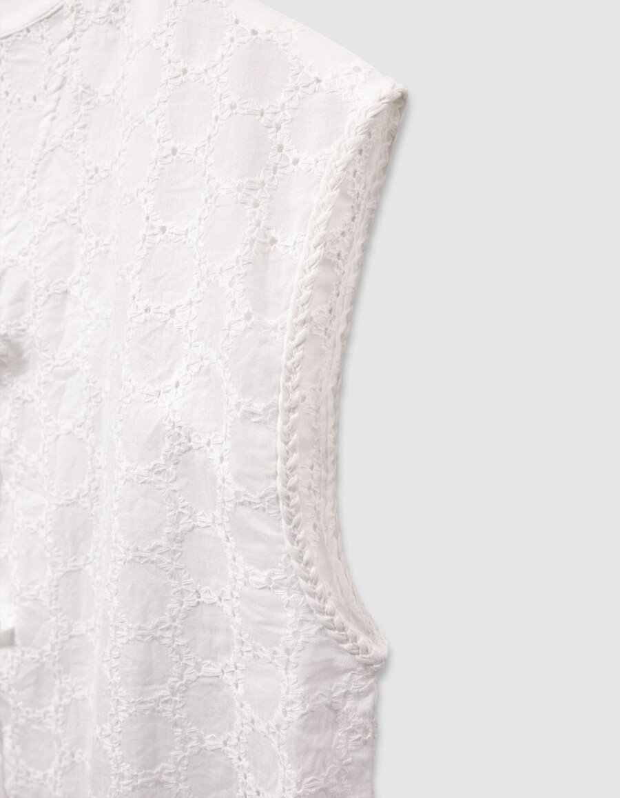 camisa blanca de encaje sin mangas para niña con lazo en la parte delantera