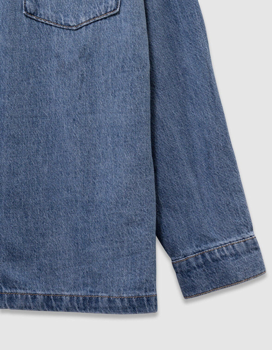 camisa vaquera azul oversize para niña