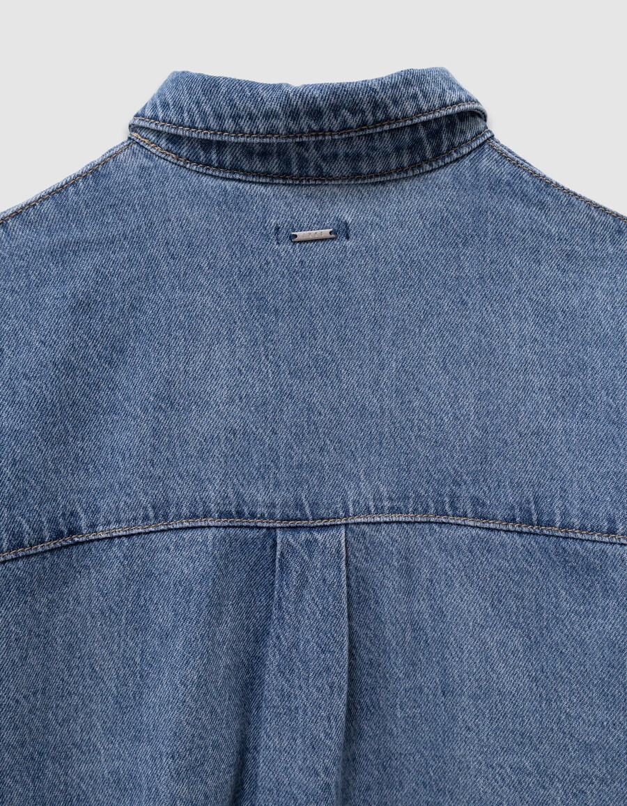camisa vaquera azul oversize para niña