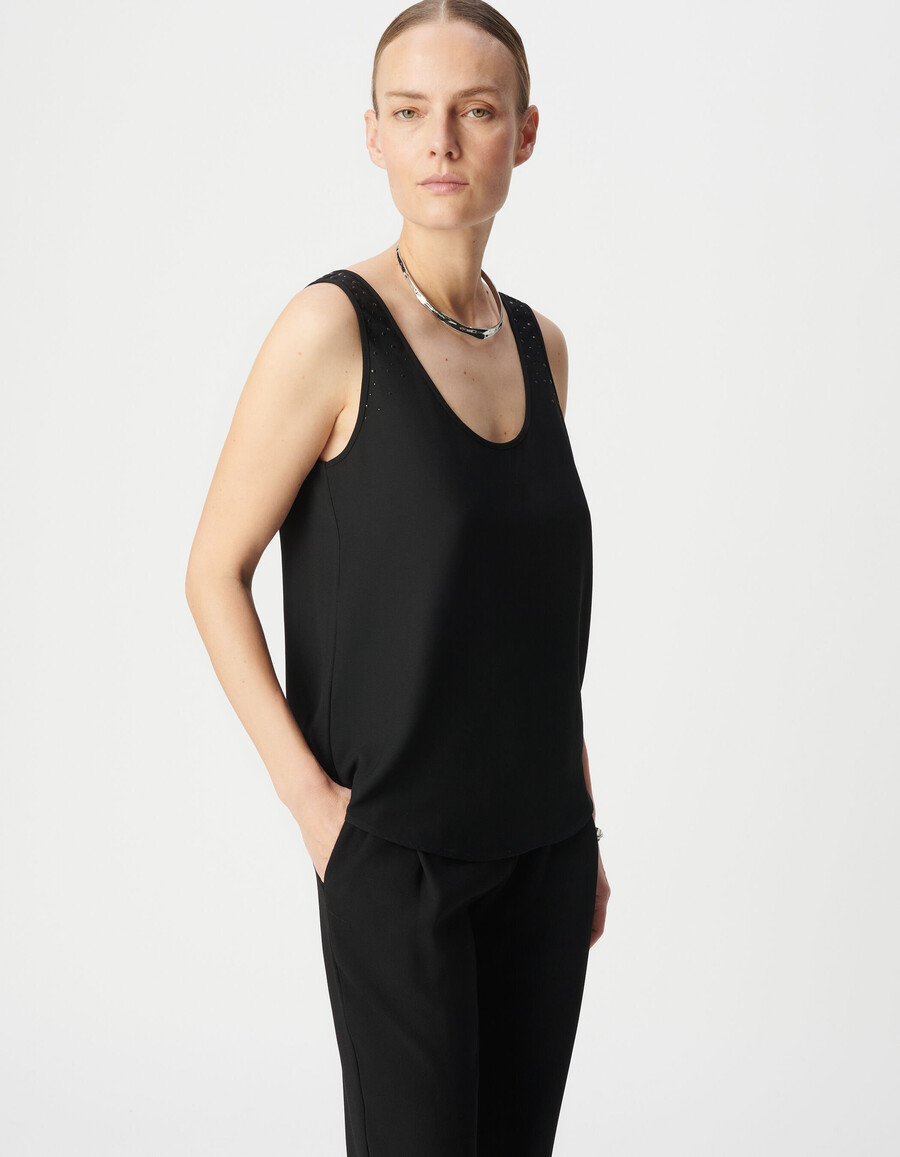 camiseta negra reversible sin mangas para mujer con tachuelas