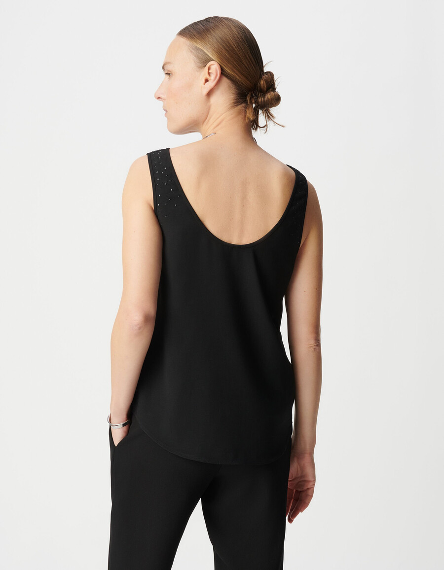 camiseta negra reversible sin mangas para mujer con tachuelas