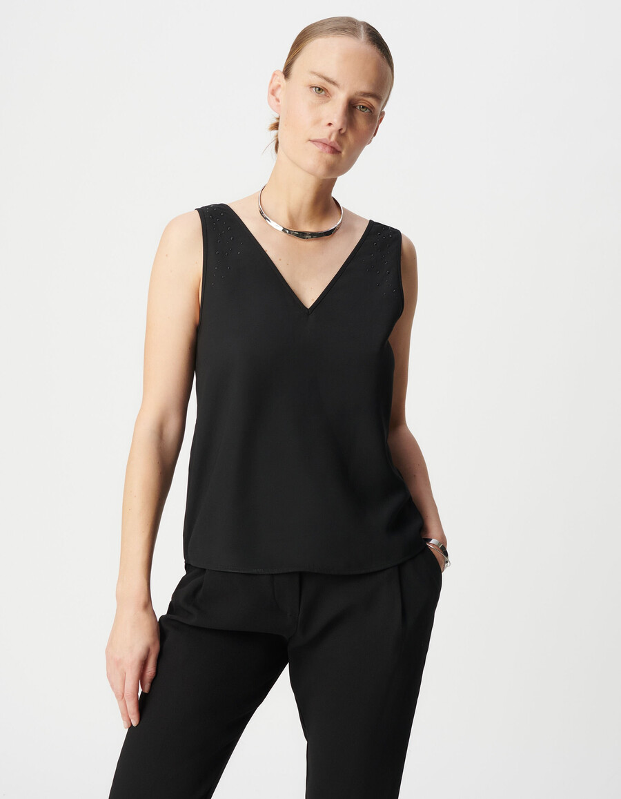 camiseta negra reversible sin mangas para mujer con tachuelas